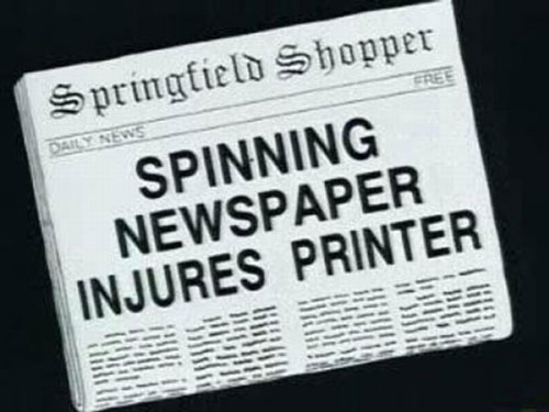 Spinning newspaper injures printer