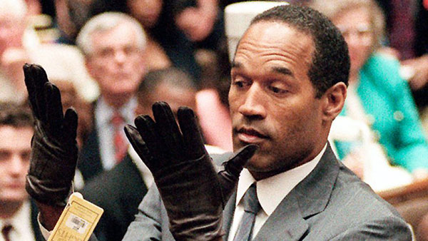 O.J. Simpson putting on the gloves